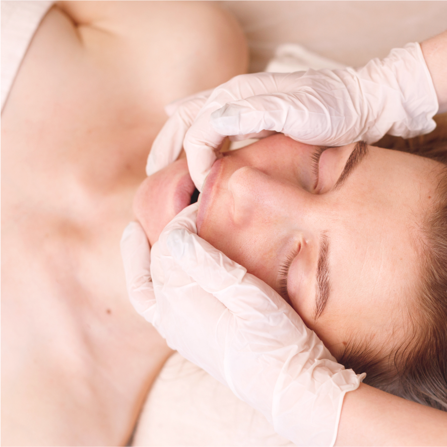 Close-up of a woman having a facial massage, showcasing the spa's professional skincare treatment