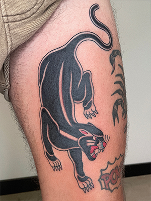 Traditional black panther tattoo