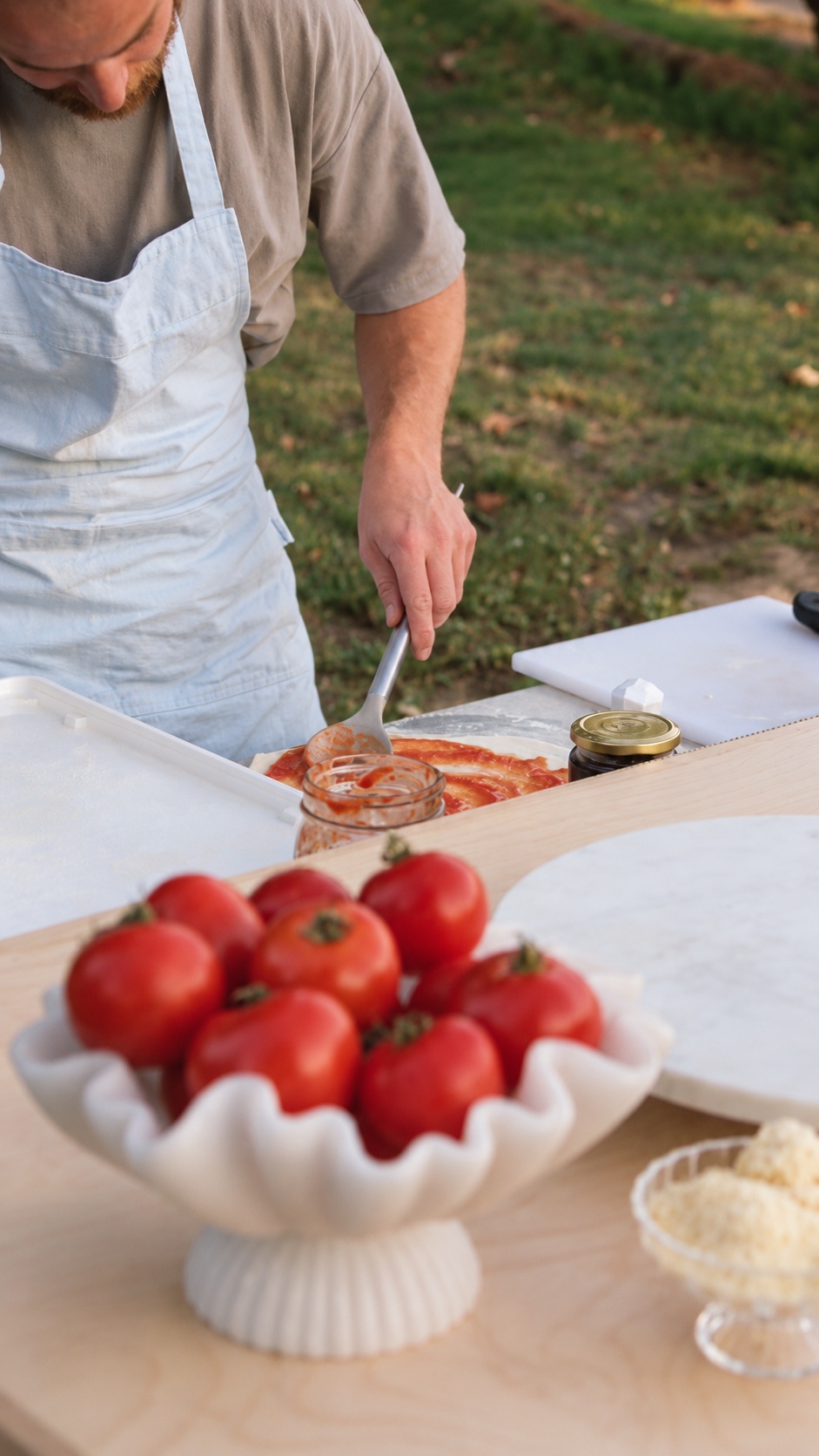 Preparing pizza with fresh tomato sauce