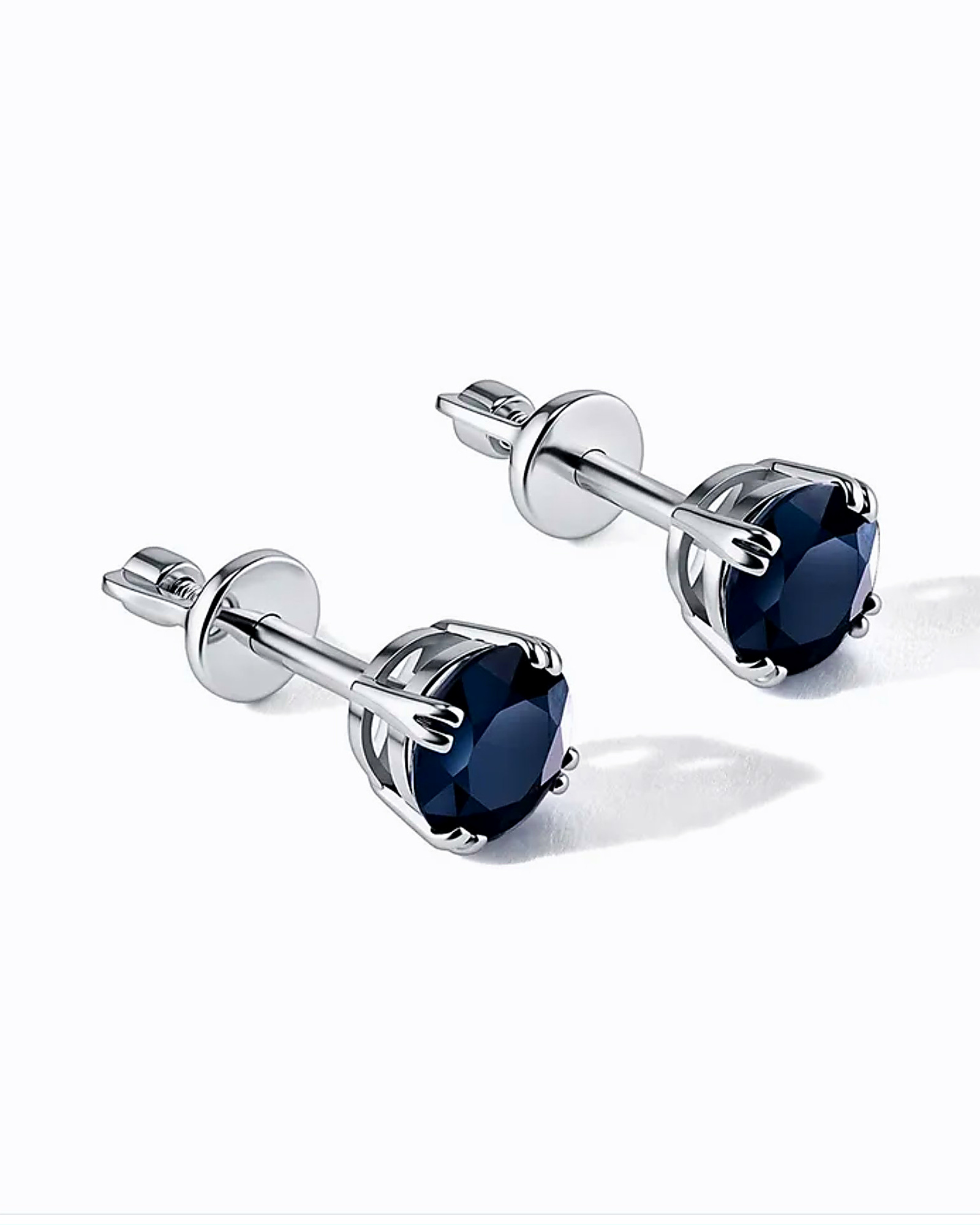 Pair of sapphire stud earrings in white gold