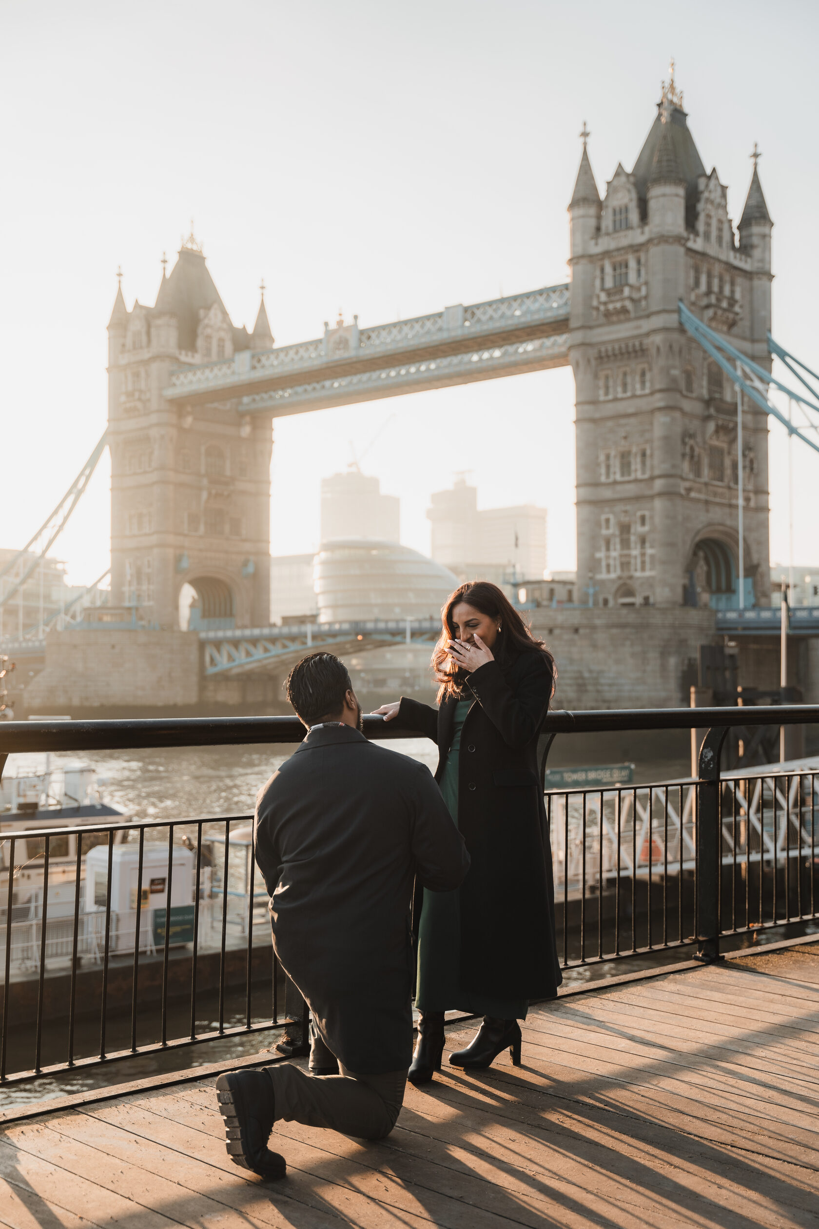 A marriage proposal beside Tower Bridge