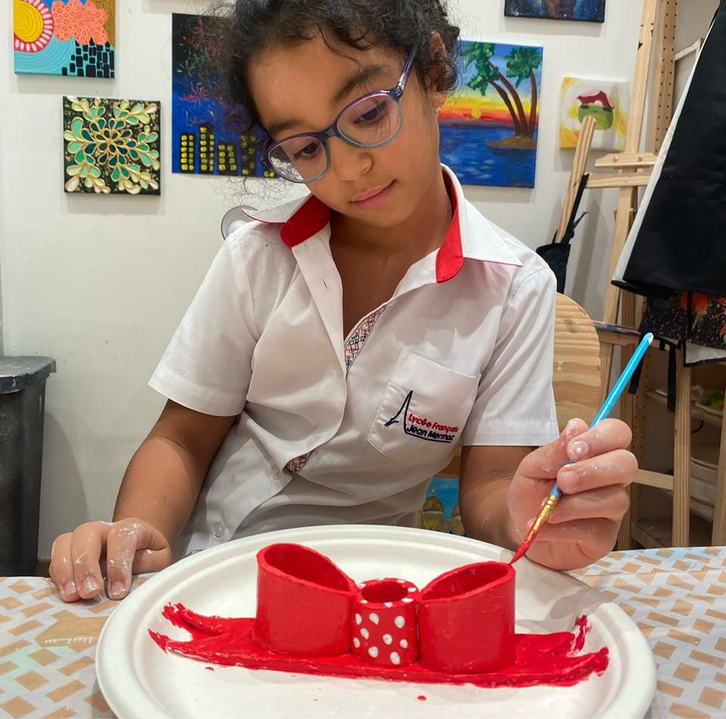 Young children learning clay modeling