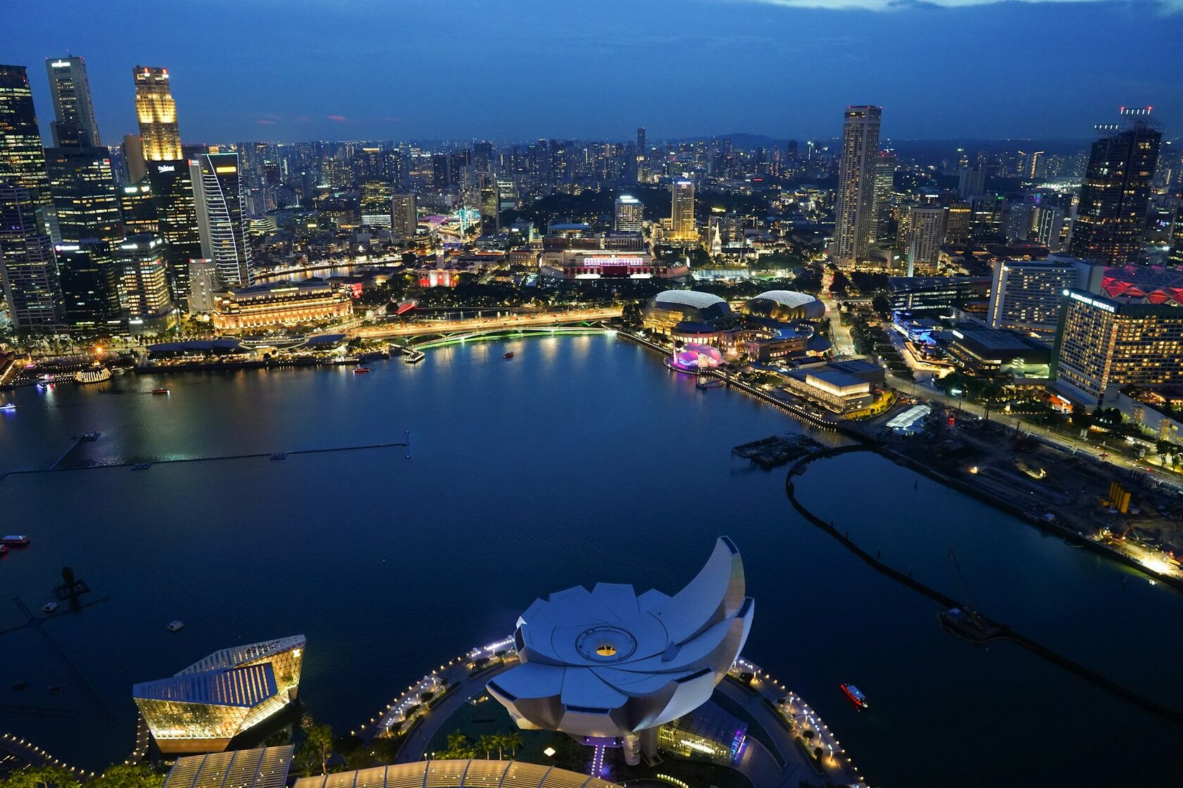 Southeast Asia skyline at dusk with high-rise towers