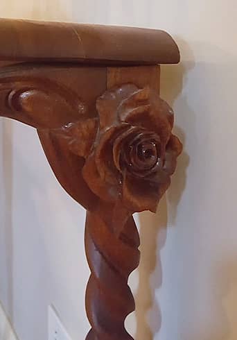 Decorative floral detail of demiluna table 