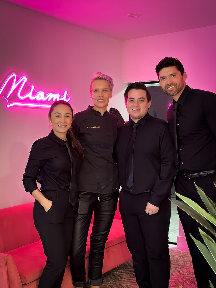Private chef Marina Staver with her service team at a private dinner in Miami