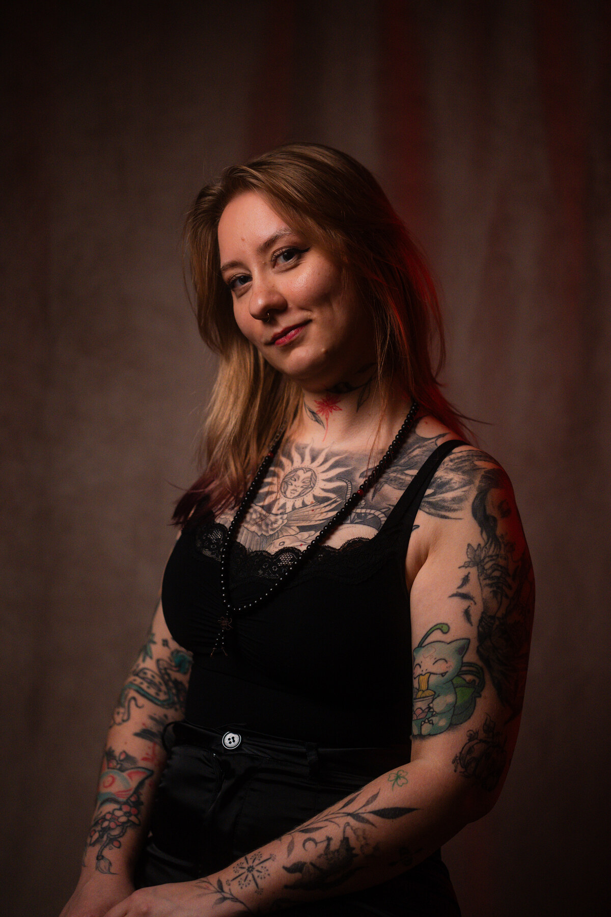 Karo, tattoo artist at INTO Tattoo Studio in Vienna for fine line and Japanese-inspired tattoos