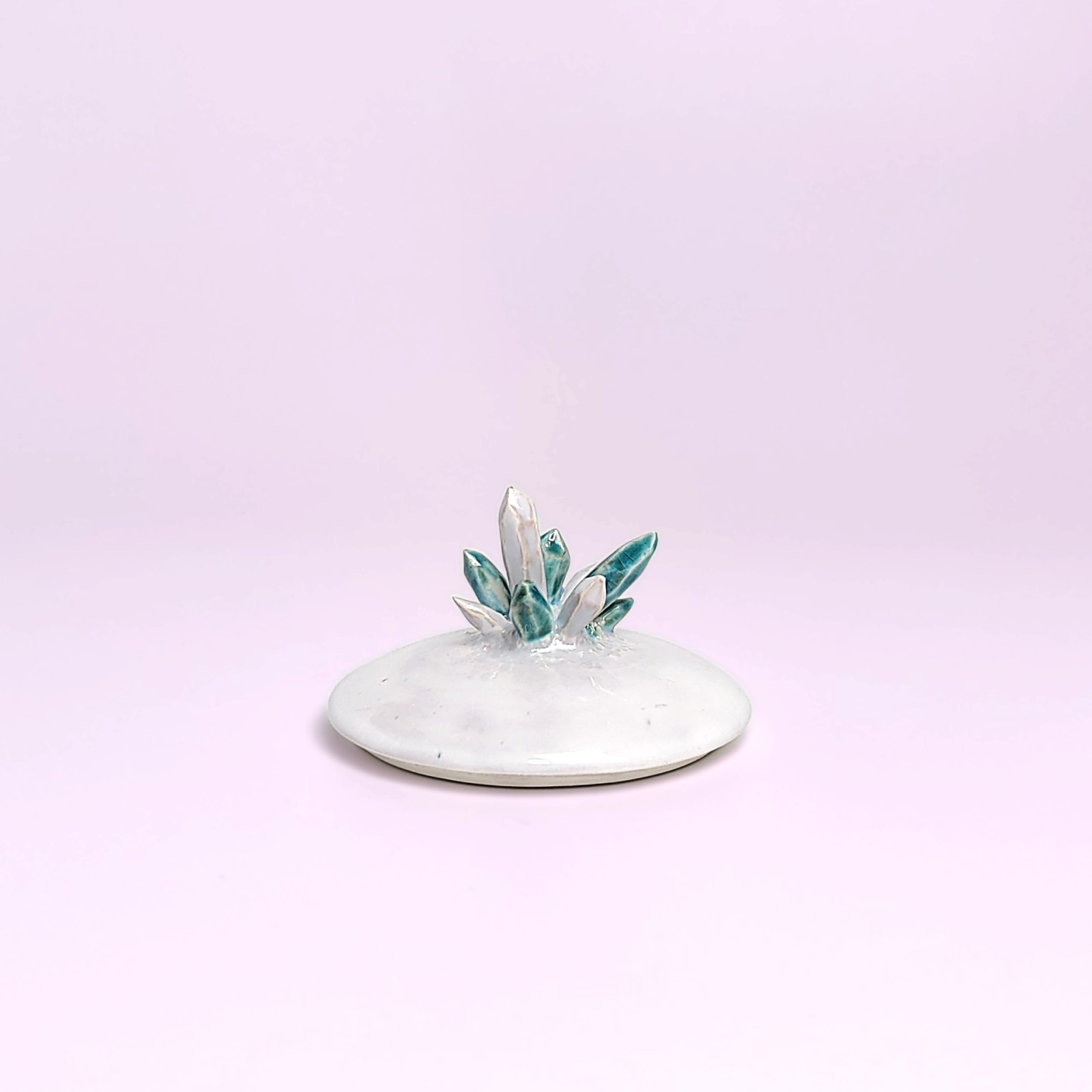 unique witchy handmade ceramic sugar bowl with a sculpted magical eye, green crystal details, and soft white glaze