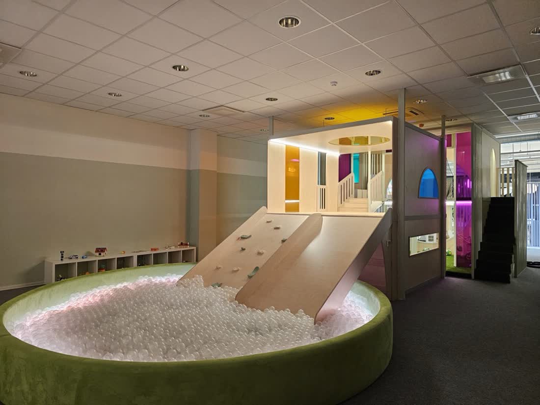 Ball pit with a slide