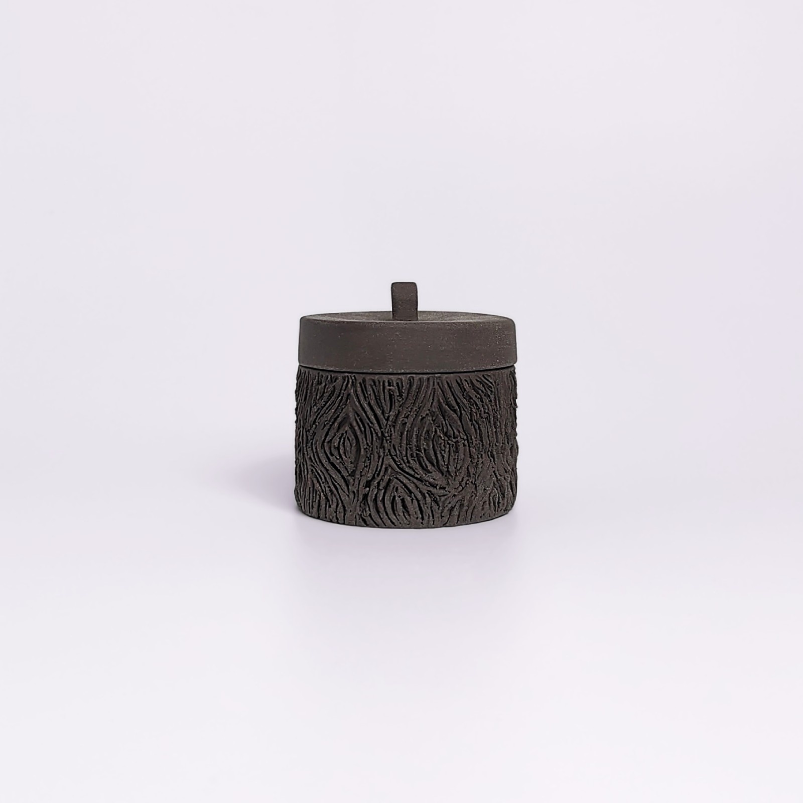 dark witchy-style ceramic box with carved wood-like texture and mystical violet glaze