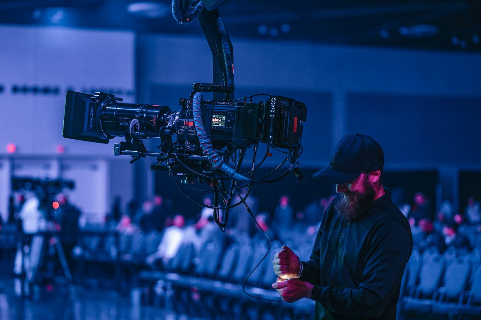 Conference hall with a video camera filming the audience