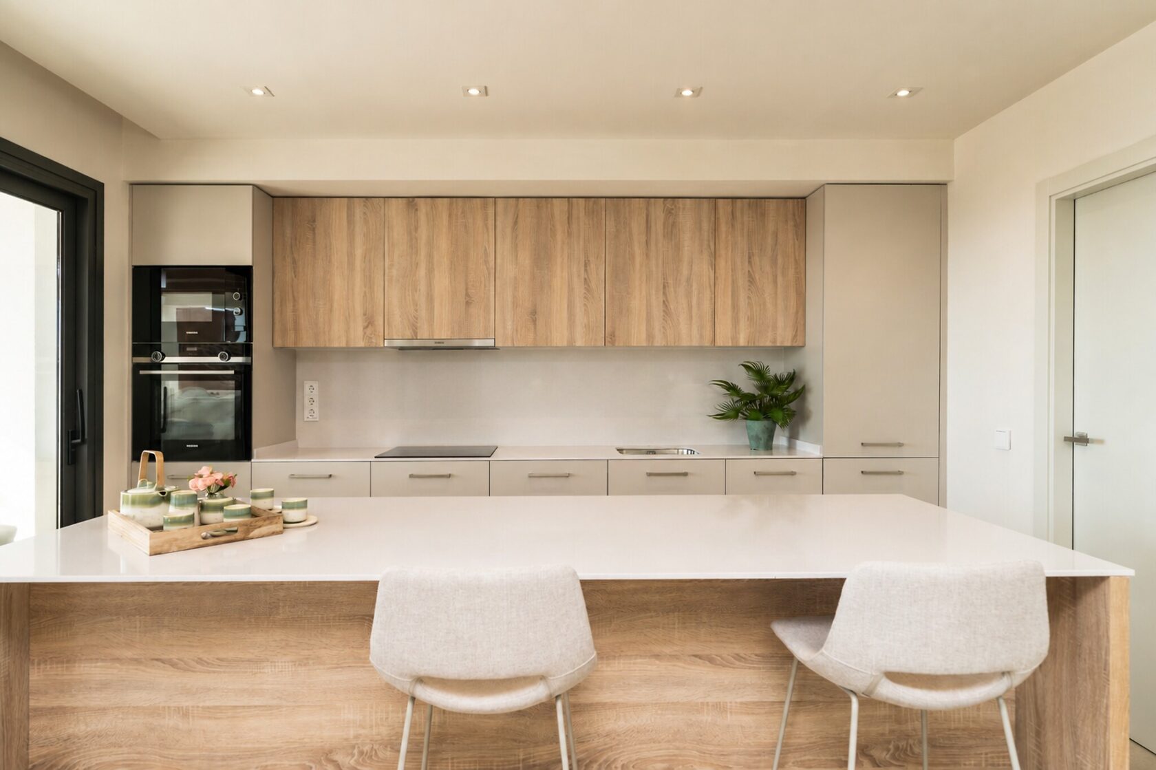 Open-plan kitchen with island and column ovens