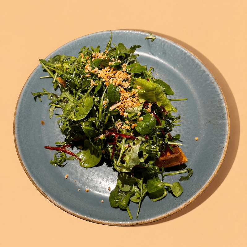 Arugula waffle with salad mix, goat cheese, walnuts and beetroot