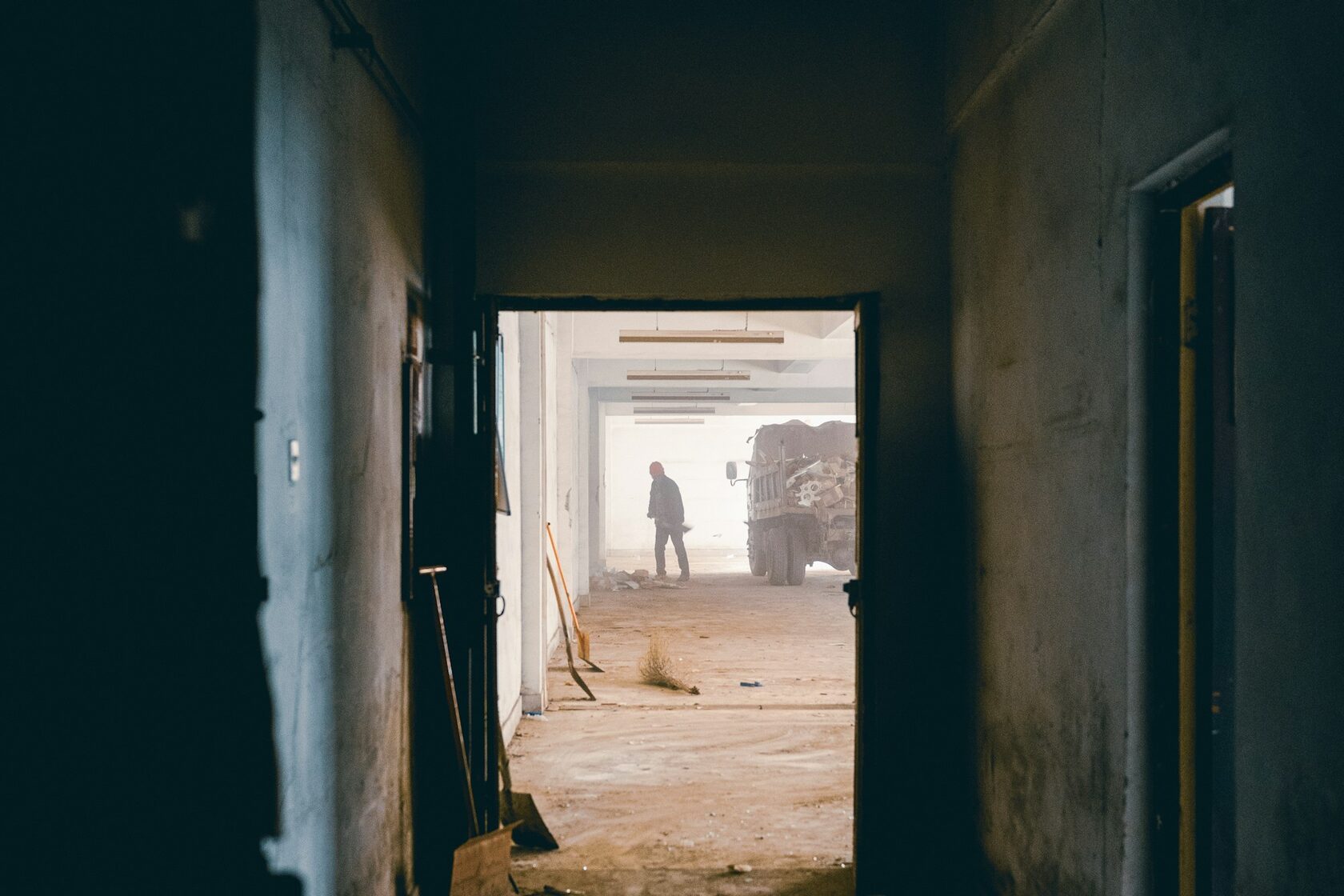 Video poster: demolition dust and debris in the stripped interior