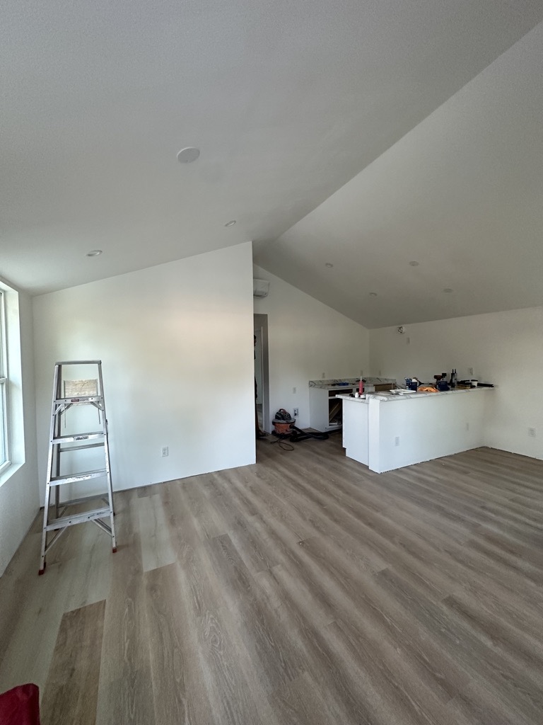 New LVP flooring, painted walls and kitchen work during the same Austin house flip