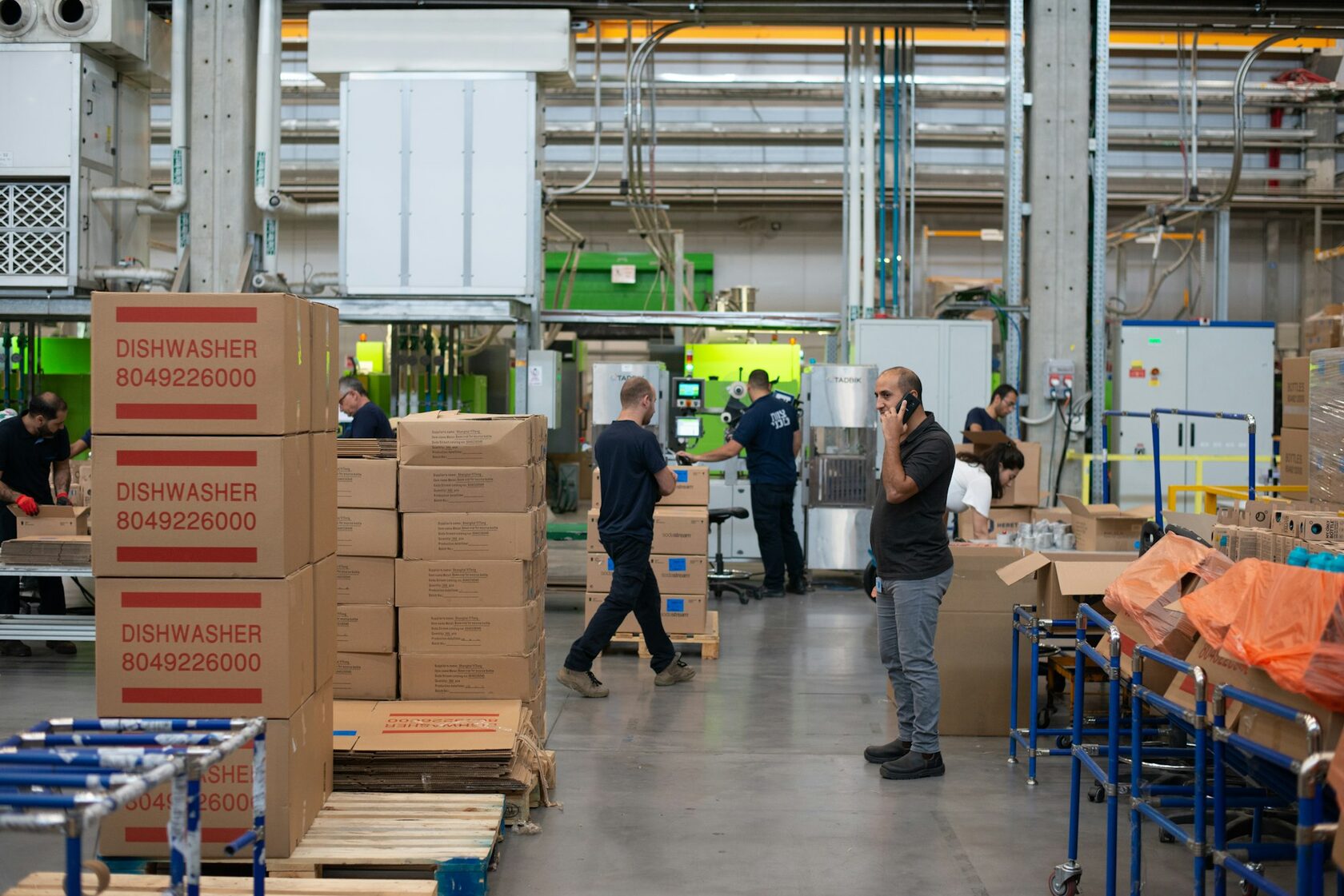 Logistics team preparing warehouse pallets for distribution