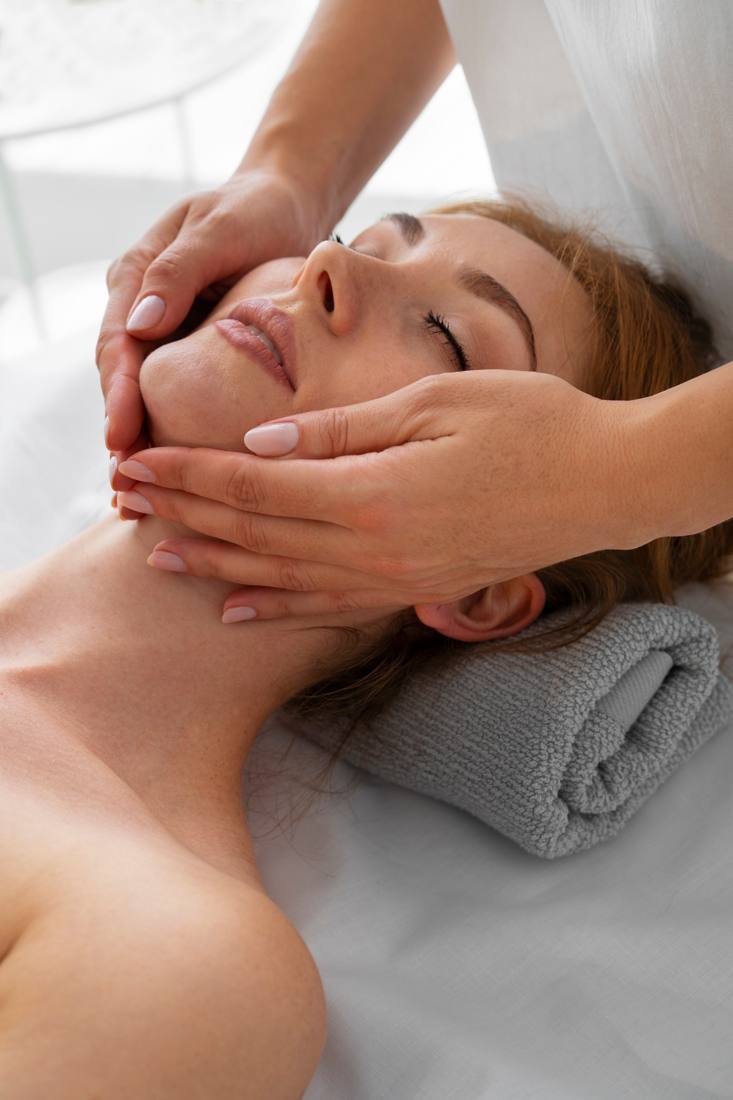 Therapist's hands during a facial massage