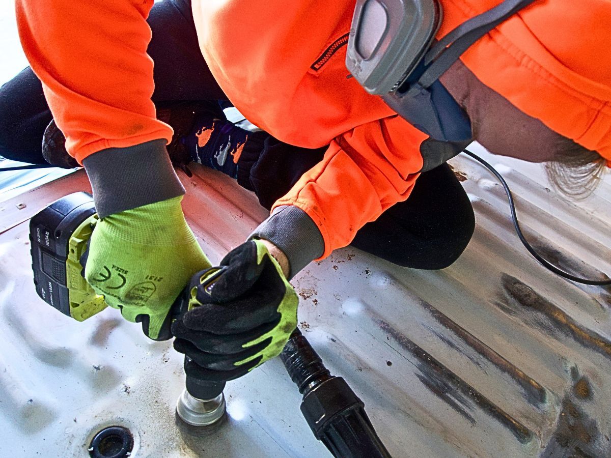 Vehicle floor inspection and rust treatment