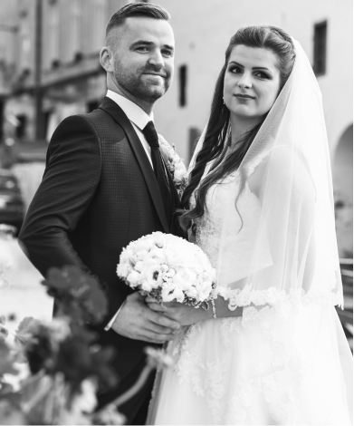 Groom and bride with a bouquet of flowers