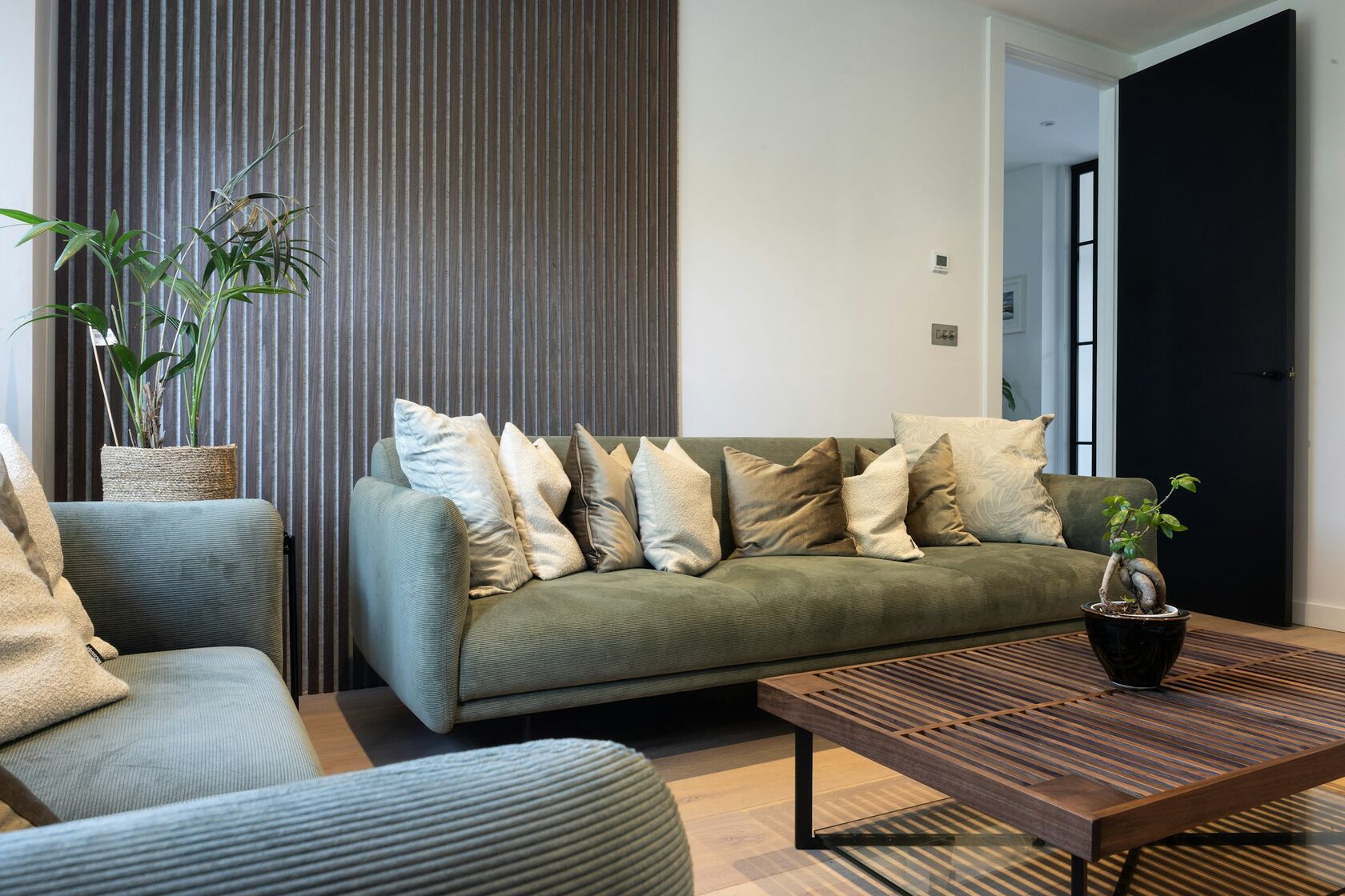 Premium modern living room with vertical natural wood slat feature wall