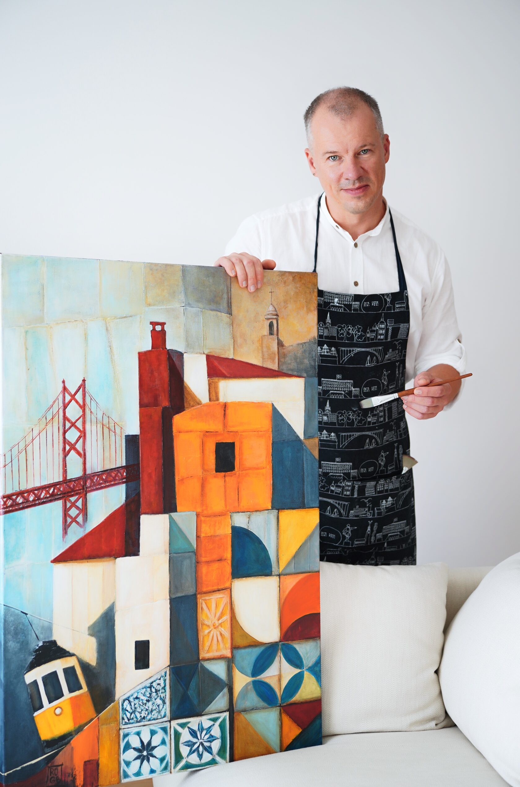 A large acrylic painting on canvas, depicting a stylised Lisbon landscape with a red suspension bridge and tiled facades