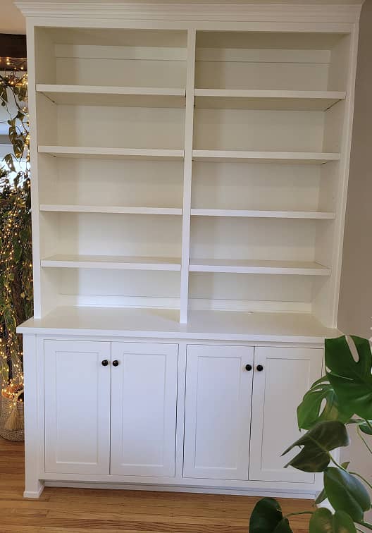 Front view of living room display cabinet with open shelves and lower storage cabinets