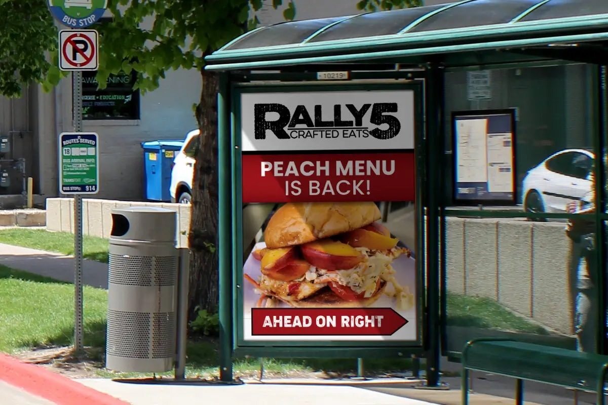 Rally's burger advertisement on a transit shelter