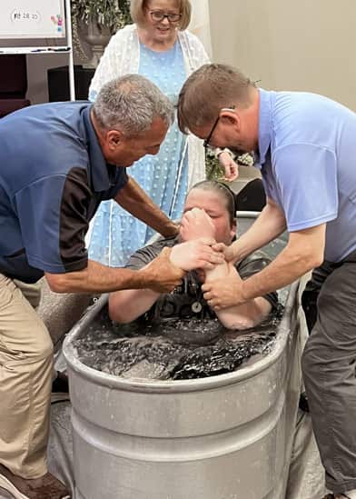 Young man being baptized