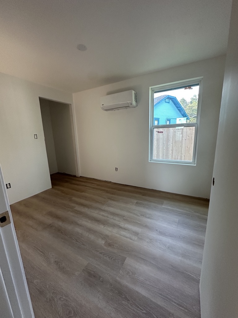 Renovated room · Flooring and painted walls — Austin house flip by Kir Remodeling