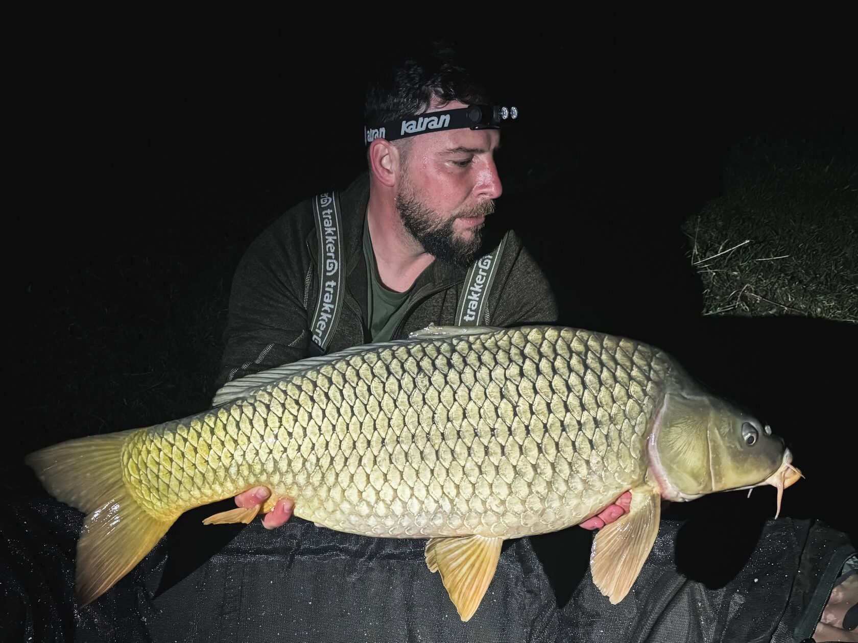 Angler using the Katran W/B 460 PRO headlamp