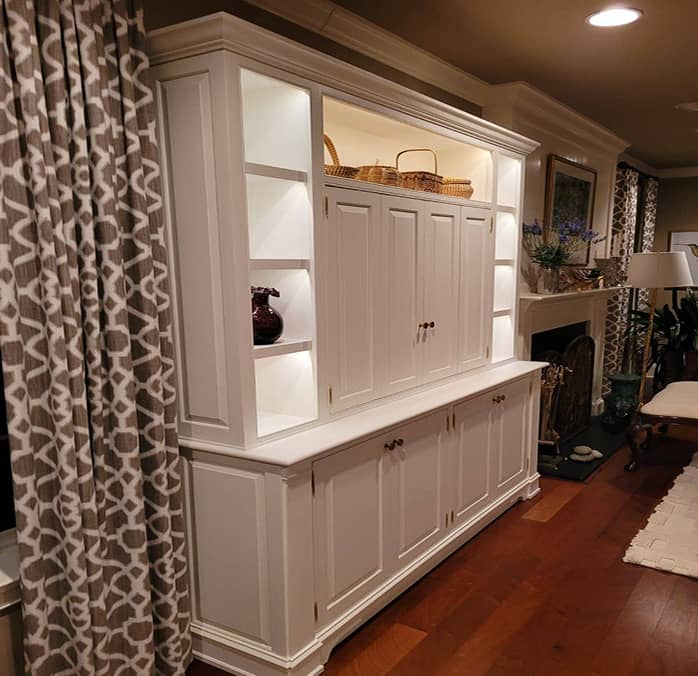 White color classic entertainment and display cabinet with concealed TV and lighted shelves