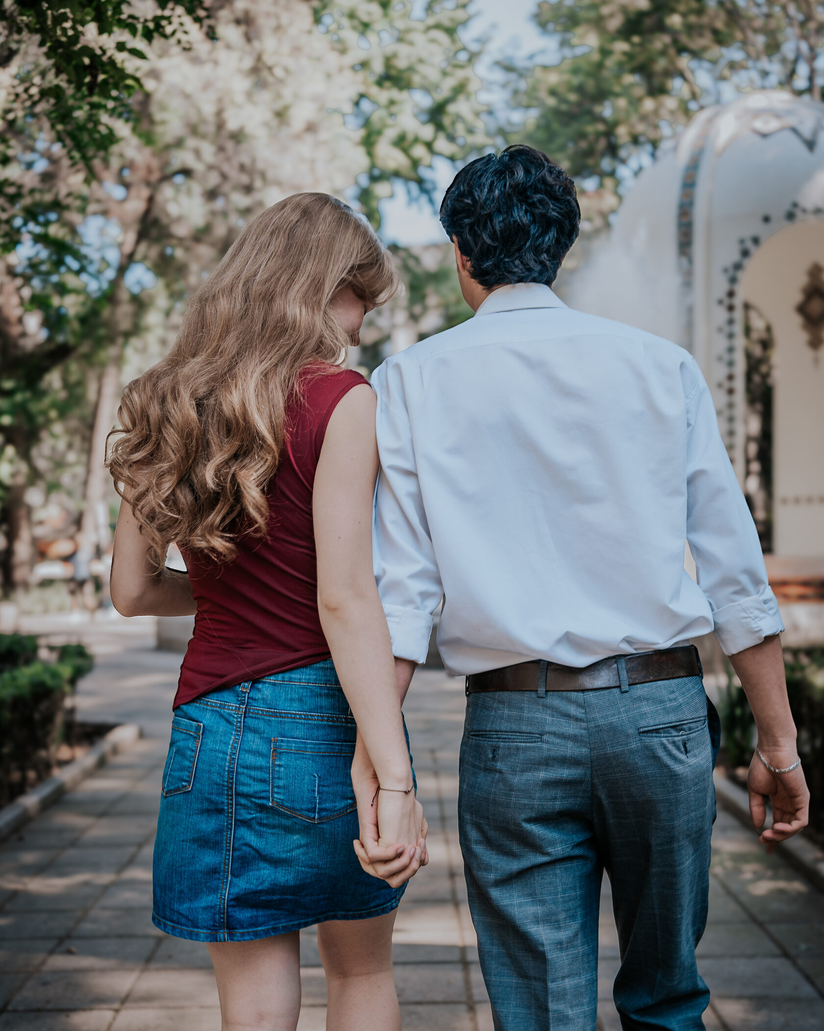 Engaged couple walking in Mexico City