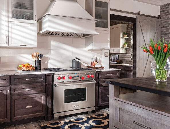 Stainless steel Wolf range with red control knobs