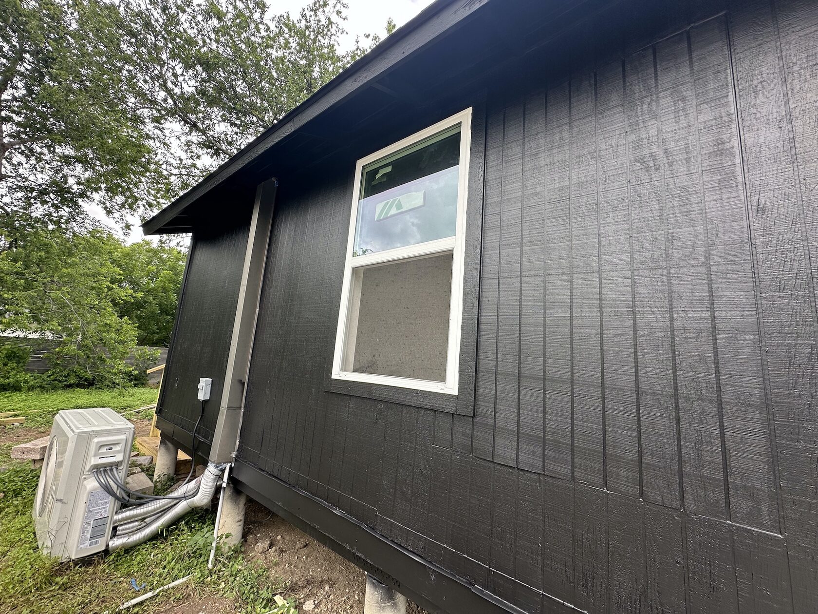 Exterior painting · Window and siding finish — Austin house flip by Kir Remodeling
