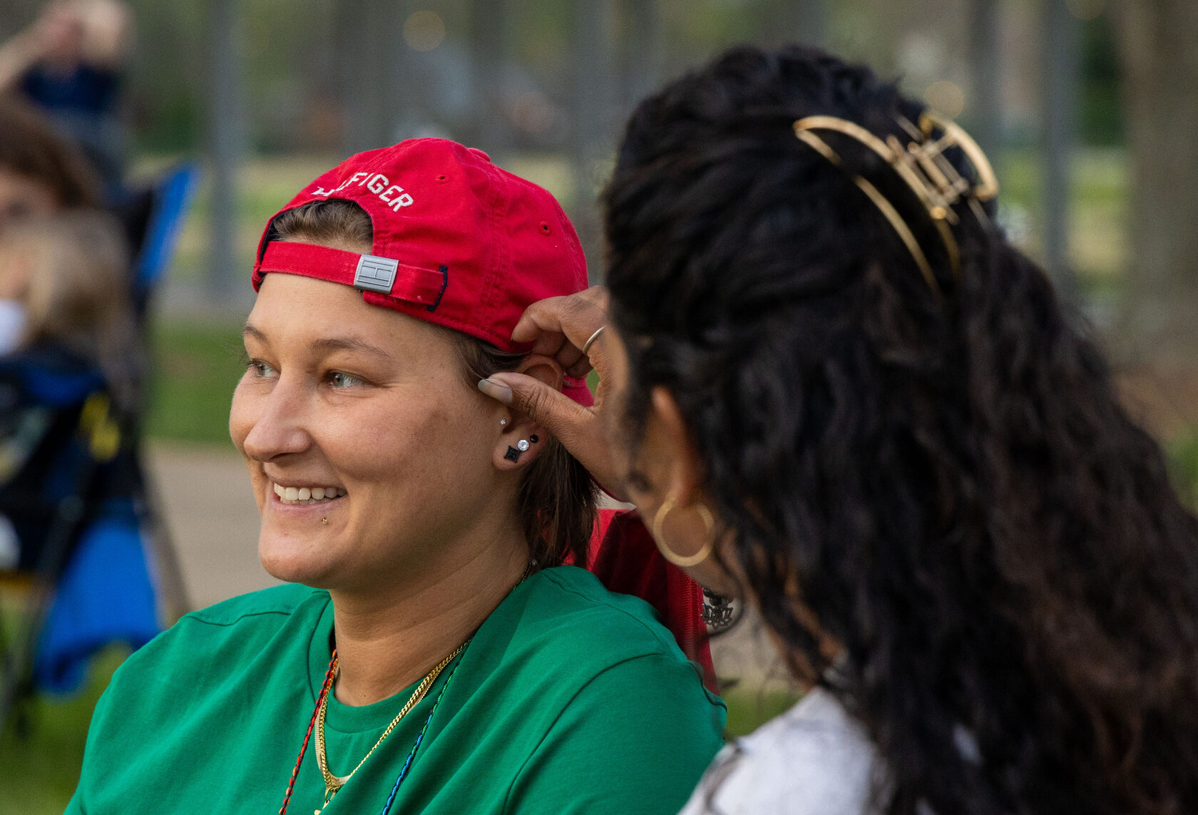 Breanna Wright (right) moves Lindsey Blair’s (left) hair our of her face at a soccer practice at Lovers Lane’s Soccer Complex in Bowling Green on Monday, April 14. Wright’s son, Carter, age 7, is from a previous relationship and is being raised by his mother and her partner. Blair and Wright have been together for five years.“We met and we’ve been together ever since.” Blair said. 