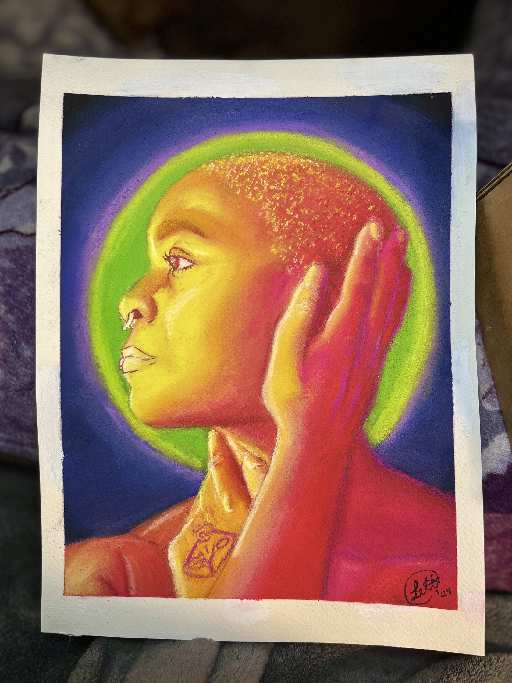 In Their Light: radiant yellow and pink profile portrait with a green halo on purple.