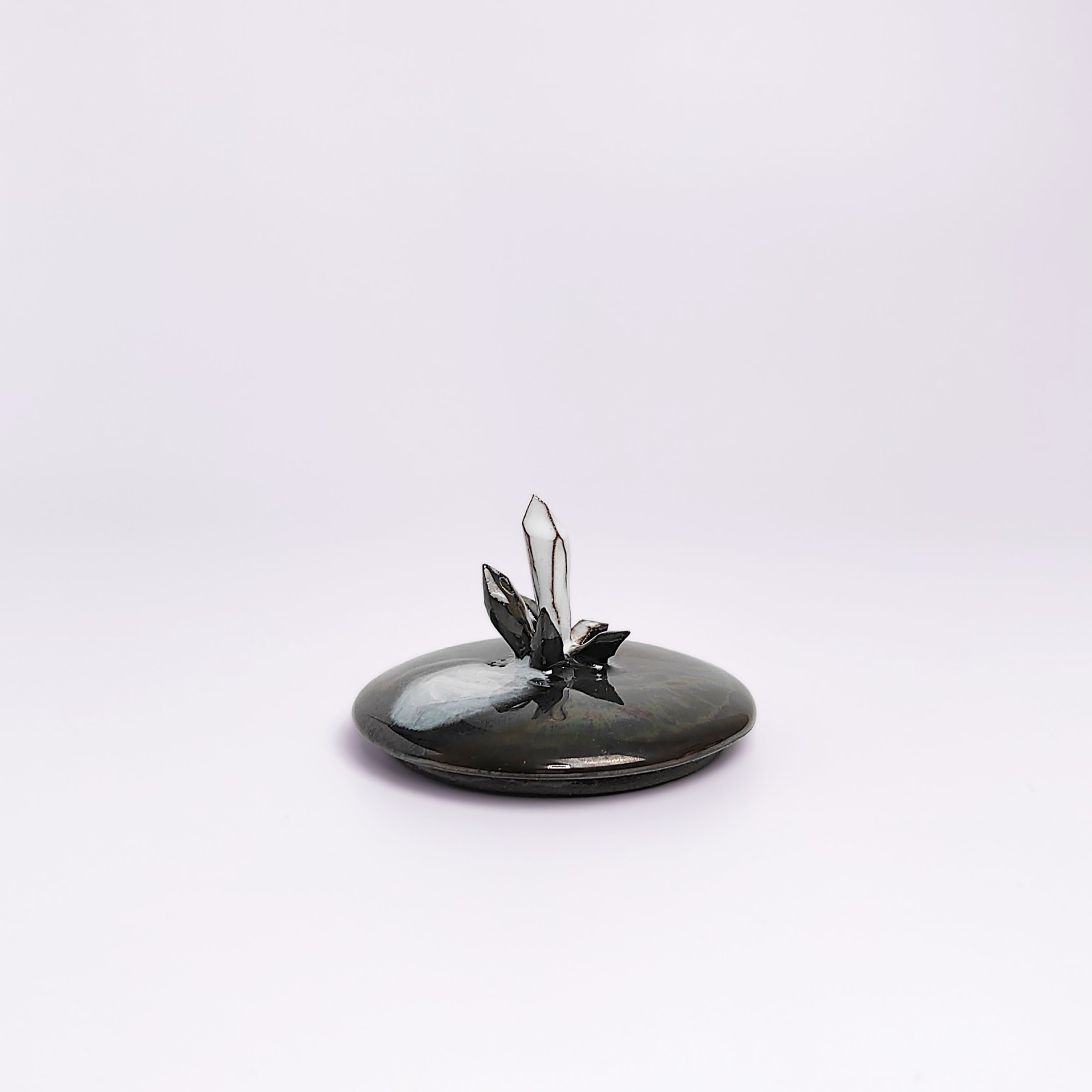 unique handmade ceramic witchy pot with a sculpted eye, black crystal accents, and a smoky dark glaze