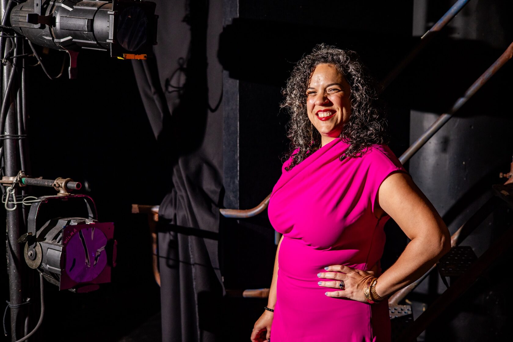 Leigh Goldenberg backstage among stage lights