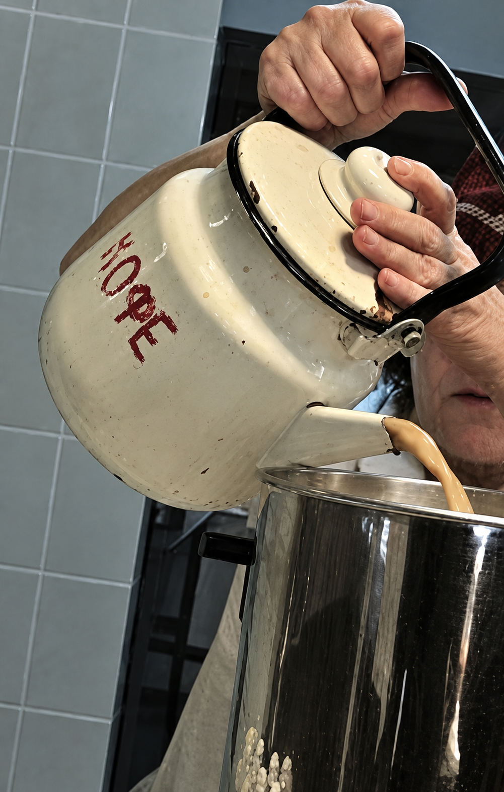 Coffee being poured into a Domik takeaway cup