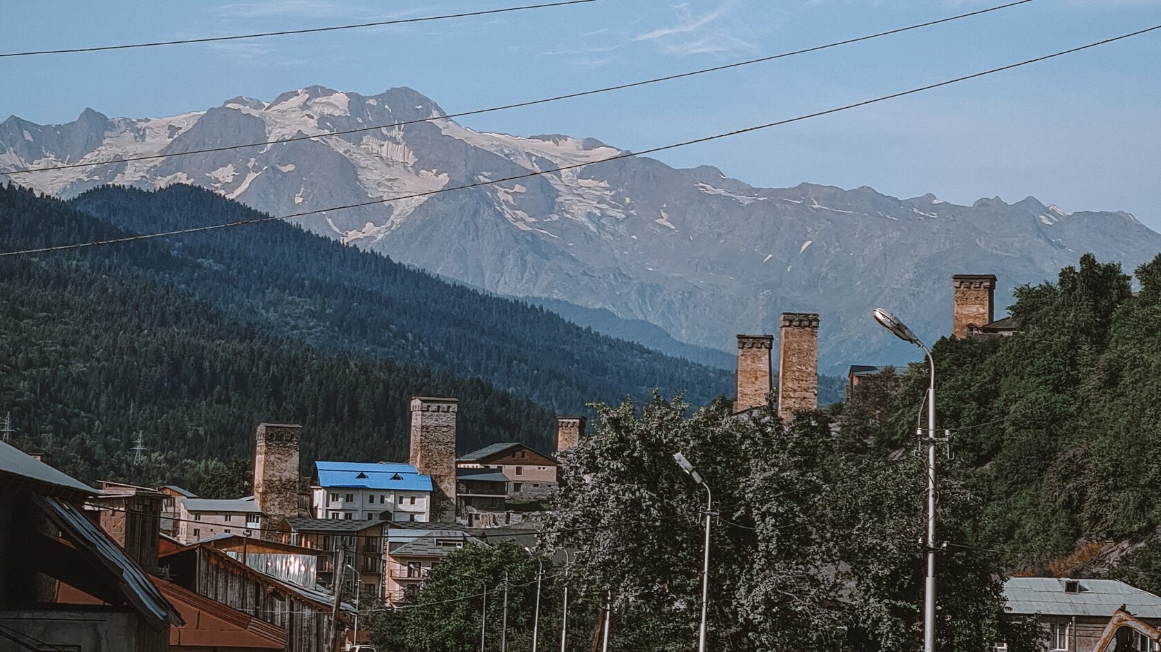 Svan towers against a backdrop of snow-capped mountains