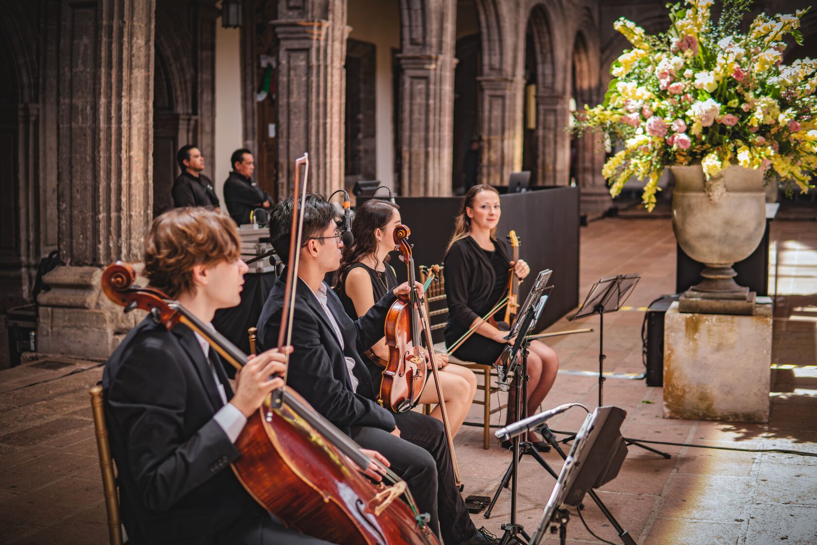 String musicians performing as part of a professionally coordinated wedding production
