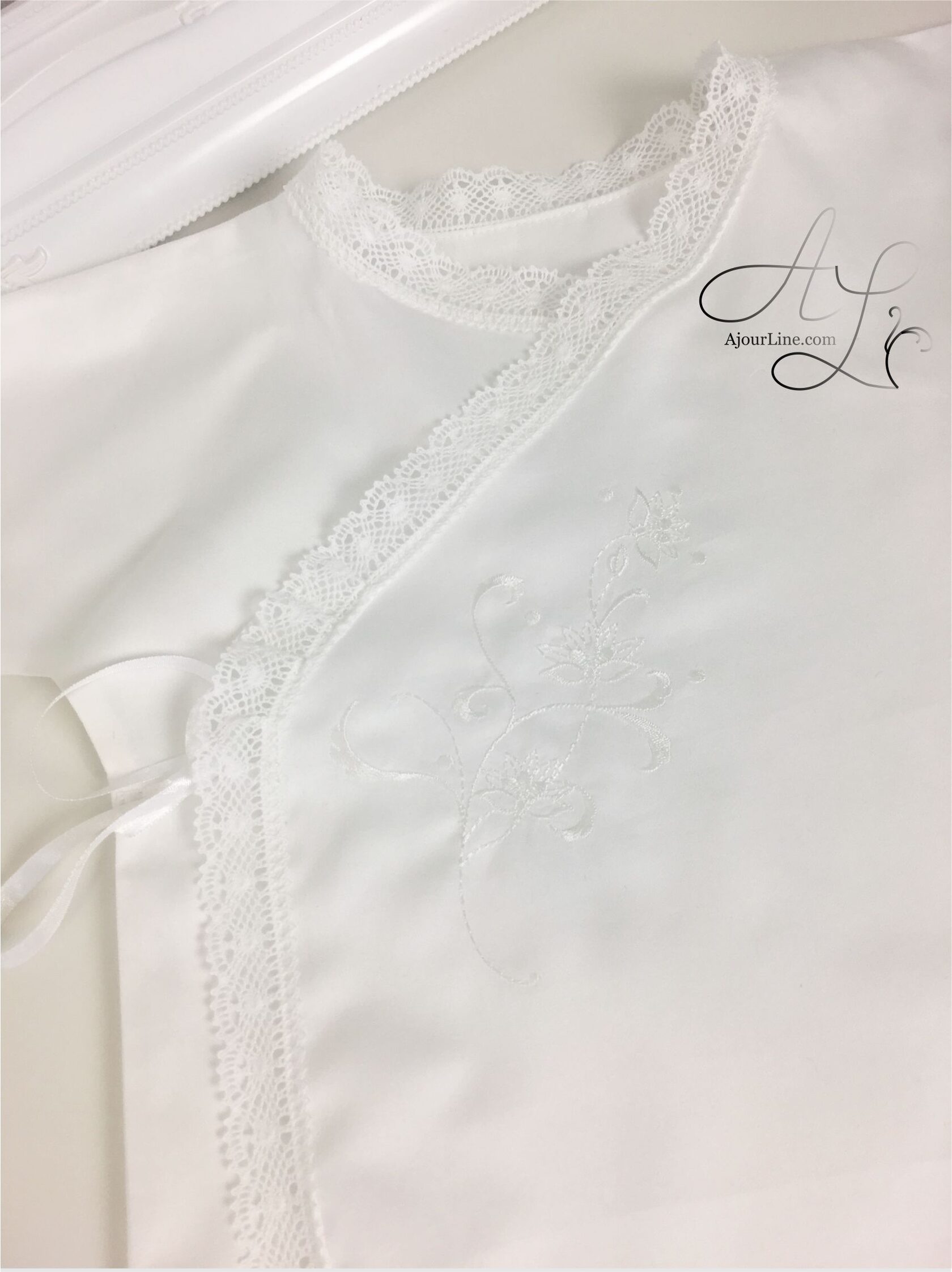Wrap-style christening shirt for babies up to one year, made from soft natural fabric with embroidery, made to order in Riga, worldwide shipping.