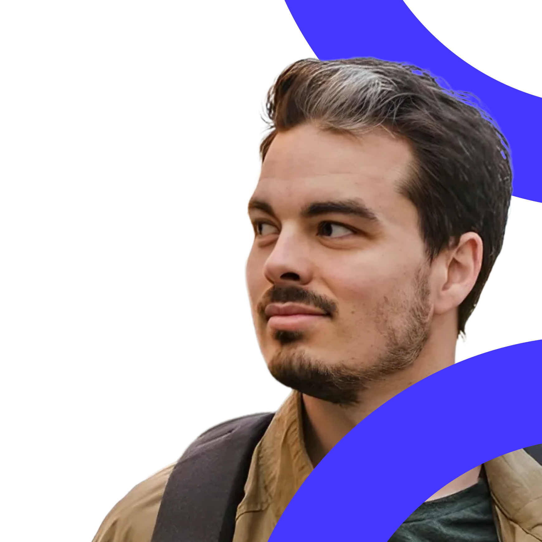 A man with a beard and moustache looks aside with interest (Kasper Timm Hansen).