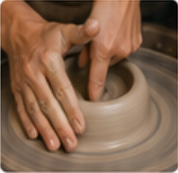 Opening clay on pottery wheel