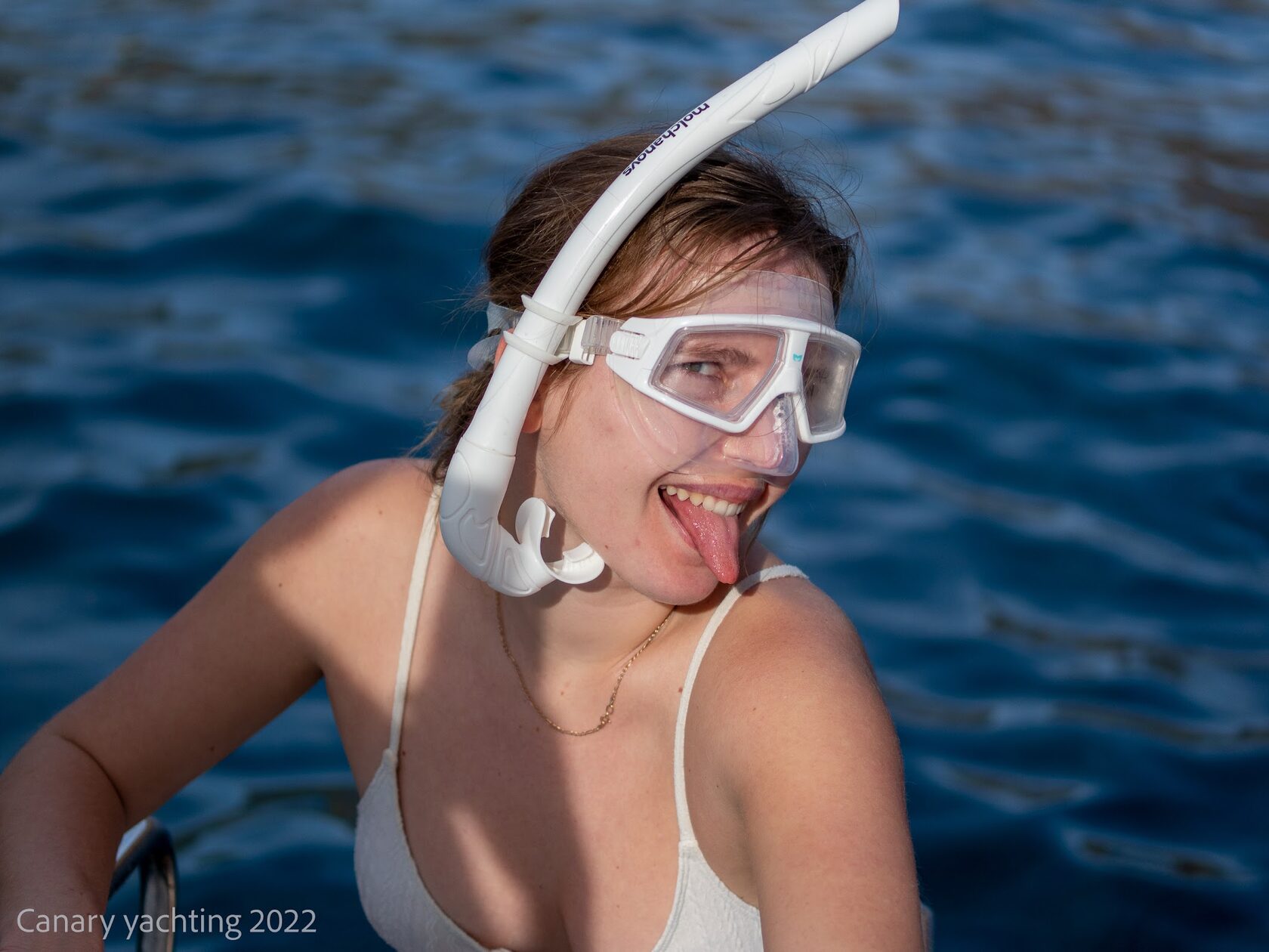 Guest snorkelling in clear blue water
