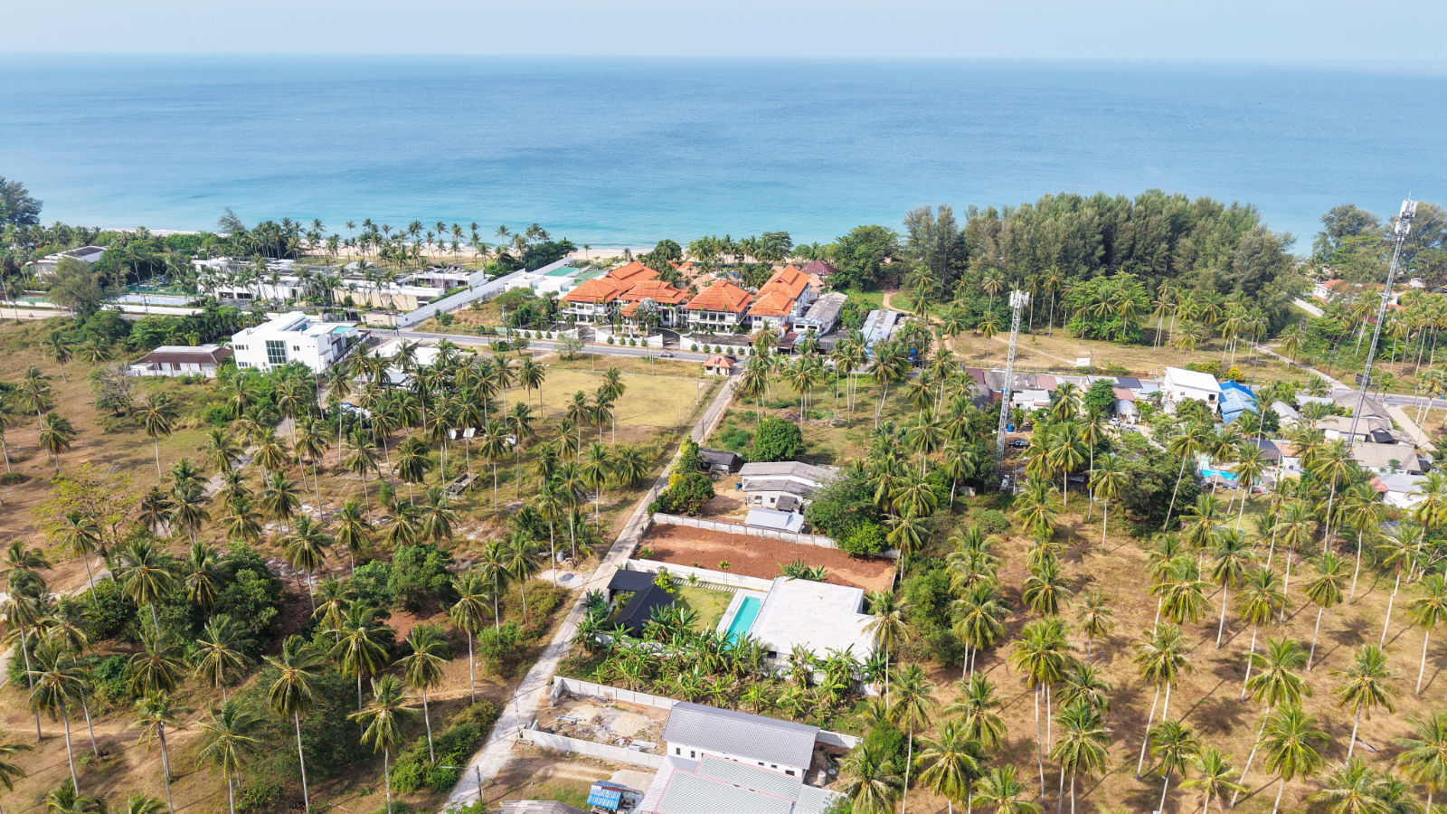 Aerial view toward the Andaman Sea from the inland pool villa, Natai
