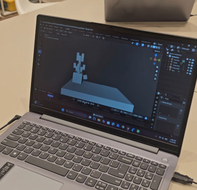 Student 3D modeling project displayed on a laptop