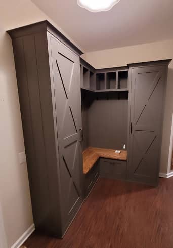 3/4 view of Farm house style mudroom cabinets with built-in bench in dark grey color