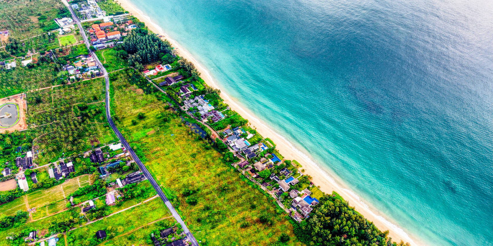 Aerial view of Natai Beach coastline, Phang Nga — ten kilometres of largely undeveloped Andaman shore