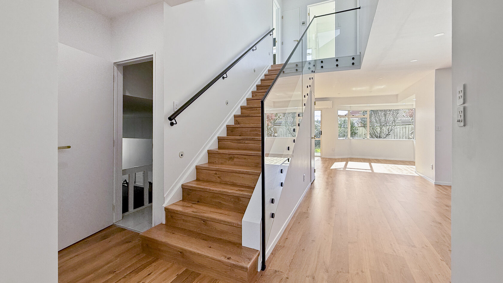After: bright St Heliers living and staircase space in the Eastern Bays after the full-home renovation