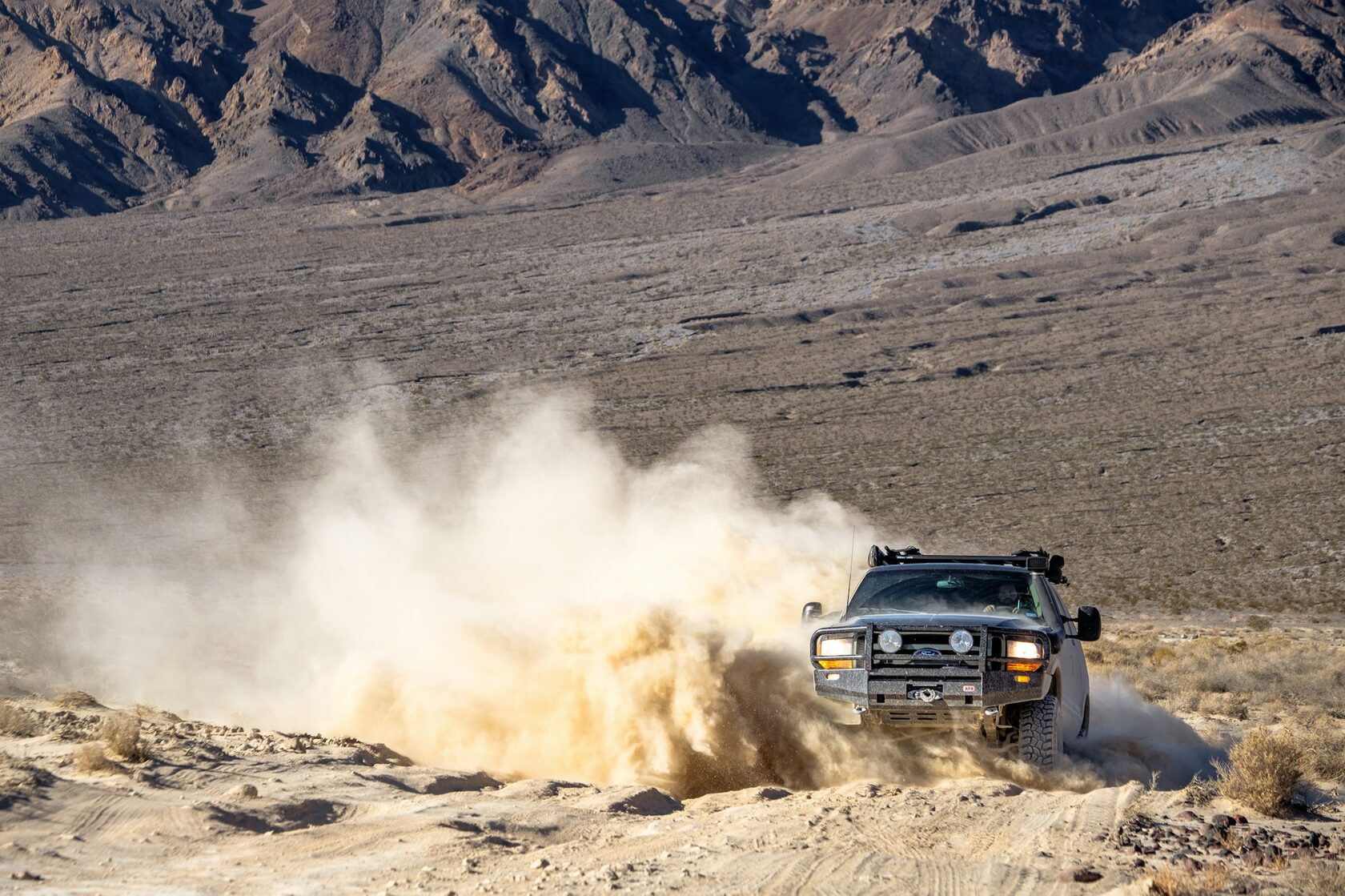 4x4 expedition vehicle on a rocky mountain road
